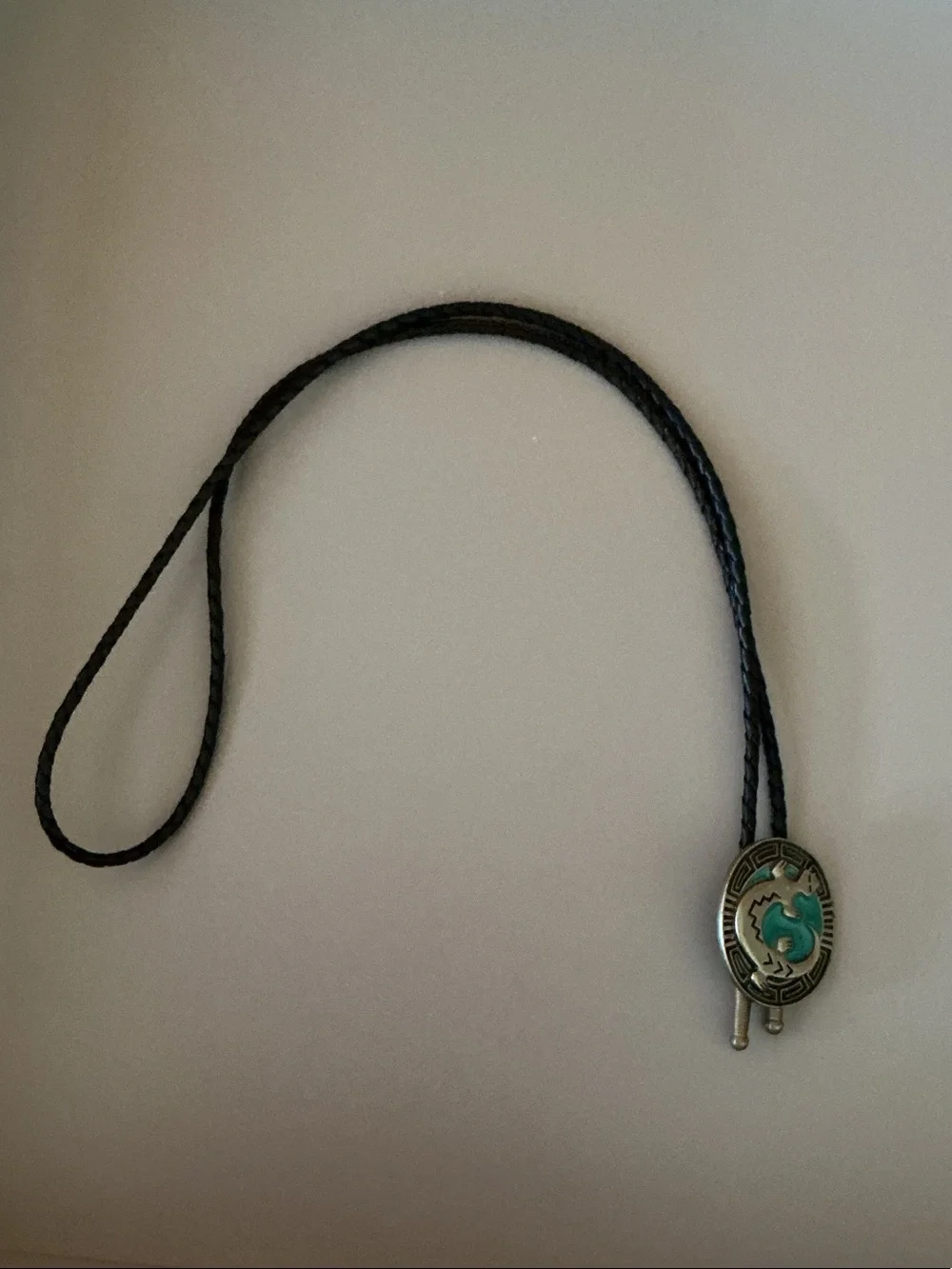 Siskiyou Buckle Co. pewter bolo tie with a braided cord and metal aglets
